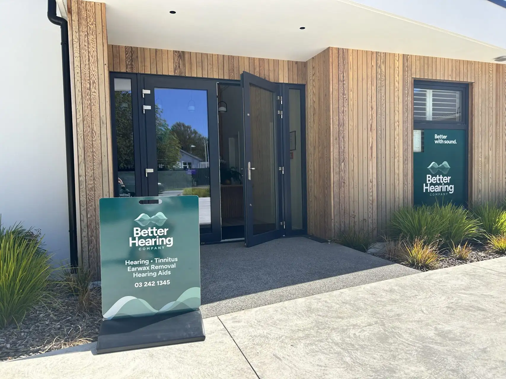 Exterior entrance and signage of Better Hearing Co. clinic on Innes Road in St Albans, Christchurch.