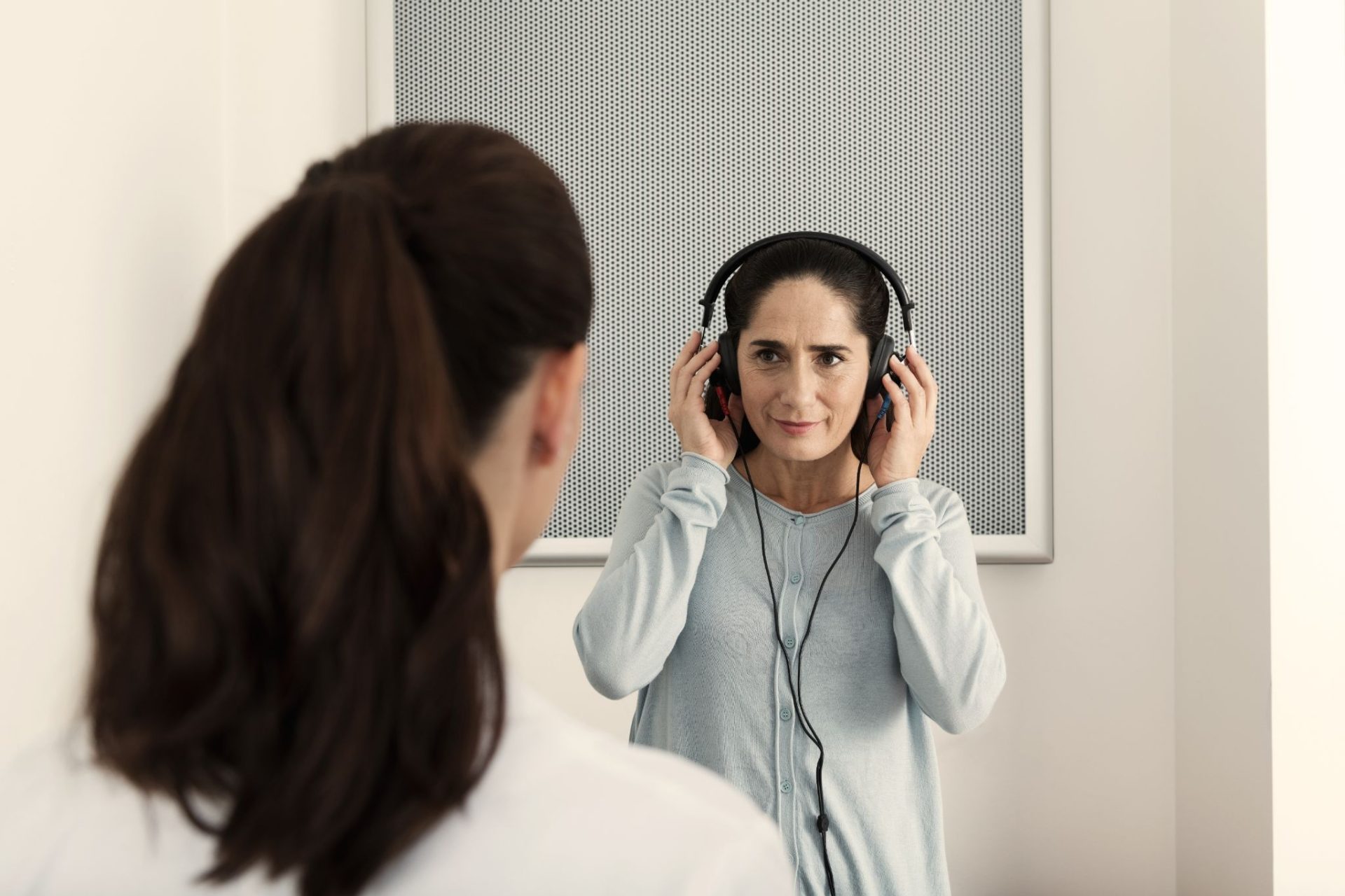 A patient wearing headphones during a comprehensive diagnostic hearing test at Better Hearing Co.