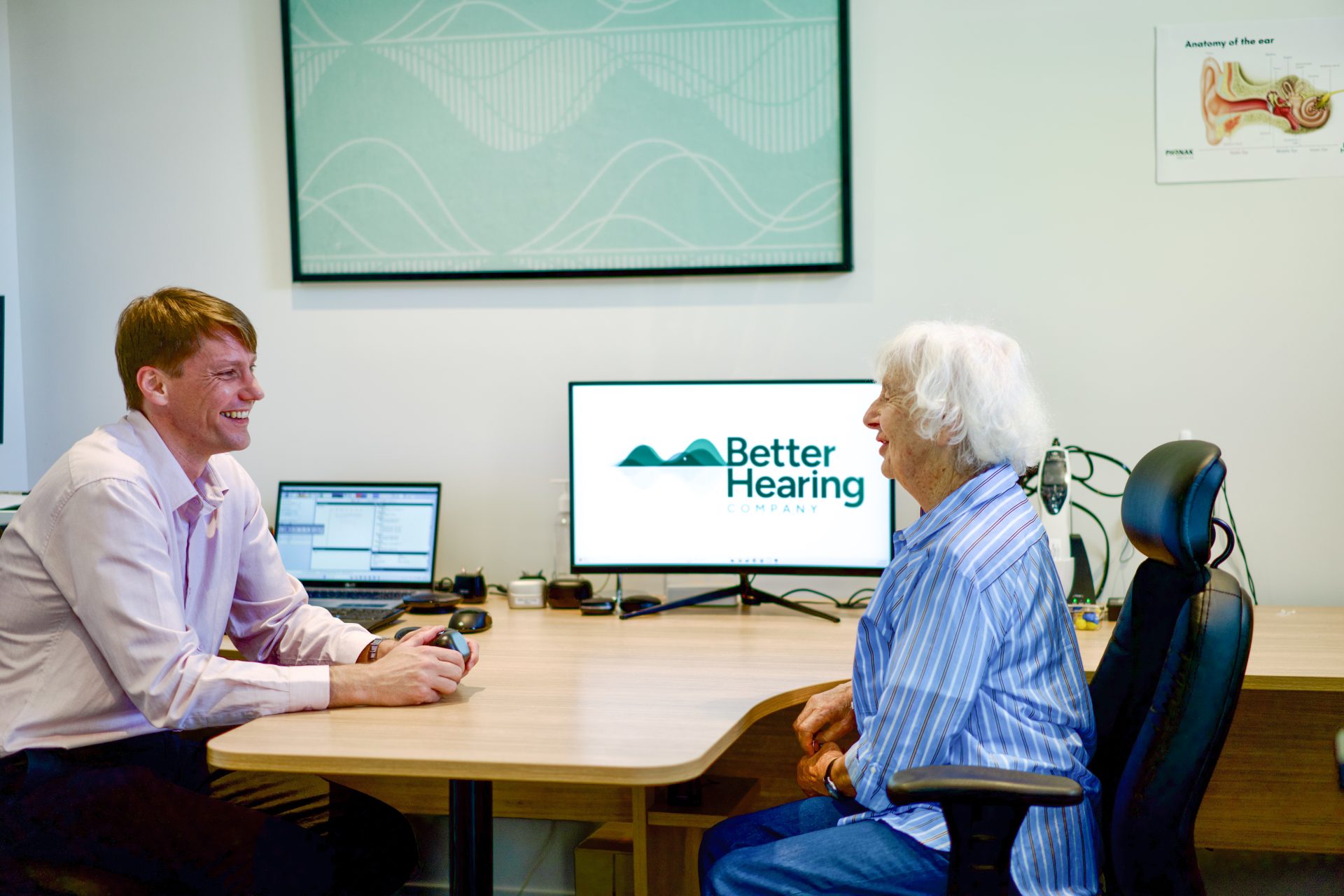 Audiologist Sam Sloane consulting with a patient at the Better Hearing Co. clinic in Christchurch.