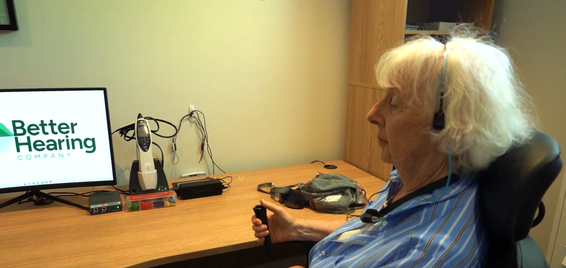 Patient completing a professional hearing assessment